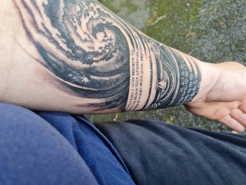 Images of my tattoo consisting of a typewriter and a nebula
